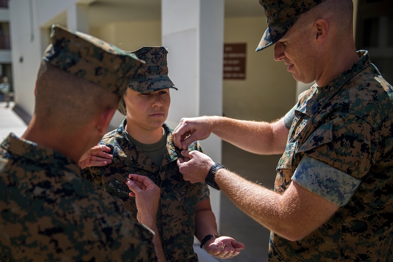 U.S. Marine Corps 1stSgt. Melisa Y. Cancienne, the Marine Corps Air Station (MCAS) Yuma Headquarters and Headquarters Squadron 1stSgt., is pinned during her frocking ceremony at MCAS Yuma, Ariz., June 3, 2019. Traditionally, a 1stSgt. serves as the senior enlisted advisor to the commander of a company, but in H&HS's case the 1stSgt Cancienne will be the senior enlisted advisor to the commander of the squadron. (U.S. Marine Corps photo by Lance Cpl. John Hall)