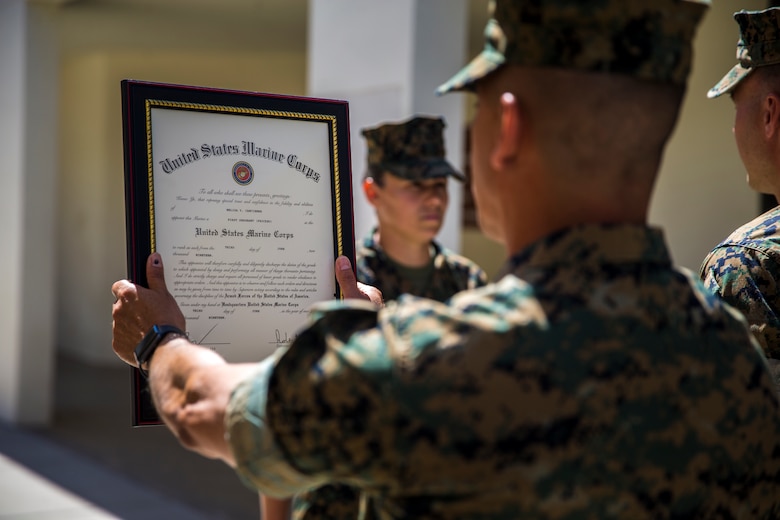 U.S. Marine Corps 1stSgt. Melisa Y. Cancienne, the Marine Corps Air Station (MCAS) Yuma Headquarters and Headquarters Squadron 1stSgt., is pinned during her frocking ceremony at MCAS Yuma, Ariz., June 3, 2019. Traditionally, a 1stSgt. serves as the senior enlisted advisor to the commander of a company, but in H&HS's case the 1stSgt Cancienne will be the senior enlisted advisor to the commander of the squadron. (U.S. Marine Corps photo by Lance Cpl. John Hall)
