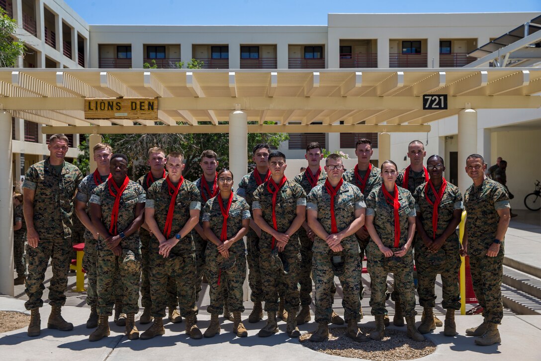 U.S. Marines assigned to Marine Corps Air Station (MCAS) Yuma Headquarters & Headquarters Squadron (H&HS) receive their blood stripes during a Blood Stripe Ceremony at MCAS Yuma Ariz., June 4, 2019. The blood stripe honors the blood that was shed by Marine officers and noncommissioned officers (NCO) during the Battle of Chapultepec in 1847 and is worn on the trousers of the NCOs, Staff NCOs, and officers in remembrance of those who courageously fought in the battle. (U.S. Marine Corps photo by Lance Cpl. John Hall)