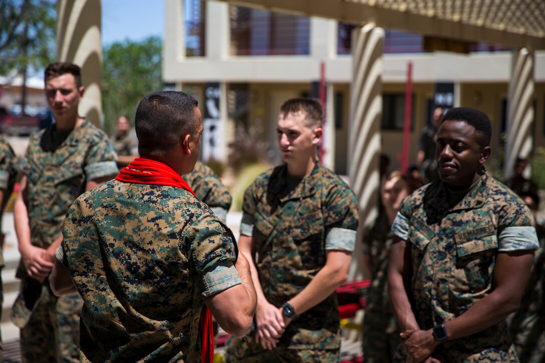 U.S. Marines assigned to Marine Corps Air Station (MCAS) Yuma Headquarters & Headquarters Squadron (H&HS) receive their blood stripes during a Blood Stripe Ceremony at MCAS Yuma Ariz., June 4, 2019. The blood stripe honors the blood that was shed by Marine officers and noncommissioned officers (NCO) during the Battle of Chapultepec in 1847 and is worn on the trousers of the NCOs, Staff NCOs, and officers in remembrance of those who courageously fought in the battle. (U.S. Marine Corps photo by Lance Cpl. John Hall)