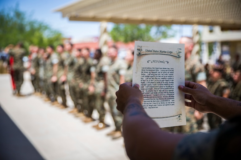 U.S. Marines assigned to Marine Corps Air Station (MCAS) Yuma Headquarters & Headquarters Squadron (H&HS) receive their blood stripes during a Blood Stripe Ceremony at MCAS Yuma Ariz., June 4, 2019. The blood stripe honors the blood that was shed by Marine officers and noncommissioned officers (NCO) during the Battle of Chapultepec in 1847 and is worn on the trousers of the NCOs, Staff NCOs, and officers in remembrance of those who courageously fought in the battle. (U.S. Marine Corps photo by Lance Cpl. John Hall)