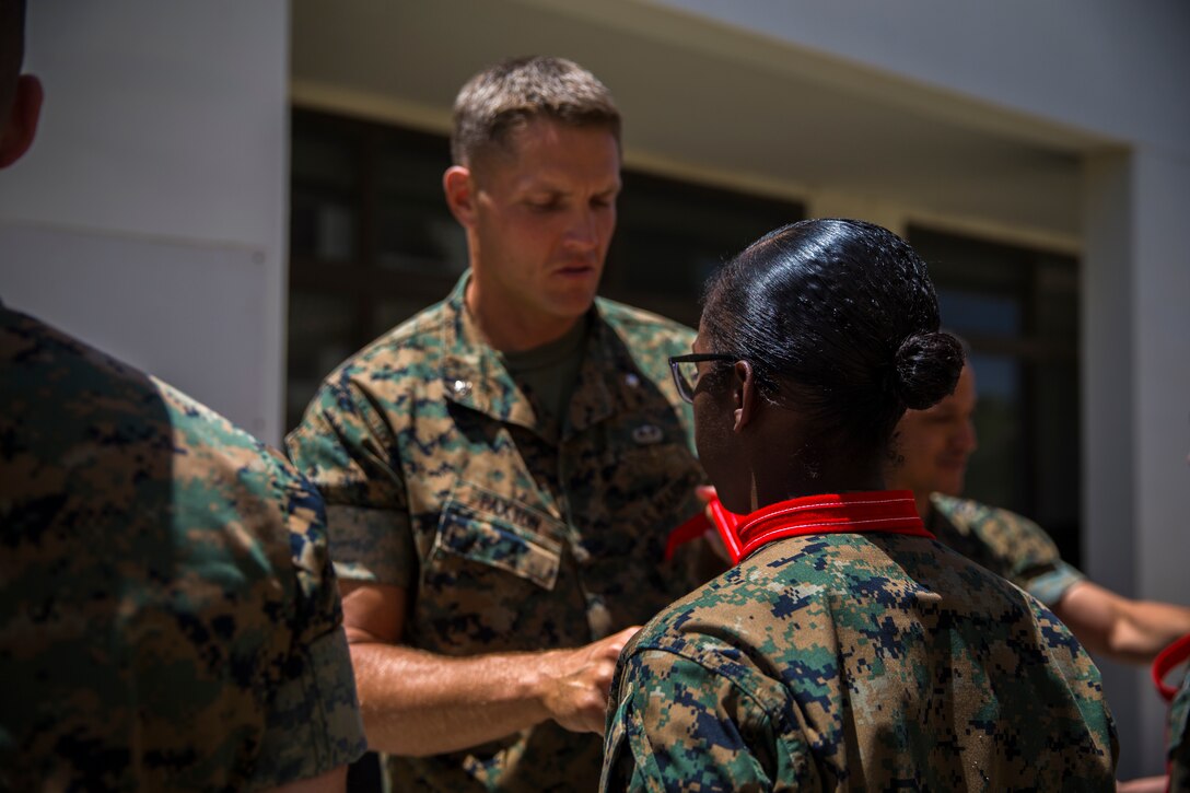 U.S. Marines assigned to Marine Corps Air Station (MCAS) Yuma Headquarters & Headquarters Squadron (H&HS) receive their blood stripes during a Blood Stripe Ceremony at MCAS Yuma Ariz., June 4, 2019. The blood stripe honors the blood that was shed by Marine officers and noncommissioned officers (NCO) during the Battle of Chapultepec in 1847 and is worn on the trousers of the NCOs, Staff NCOs, and officers in remembrance of those who courageously fought in the battle. (U.S. Marine Corps photo by Lance Cpl. John Hall)