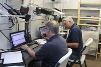 2nd Lt. Britt Fitts, mission radio operator, and 1st Lt. Danny Green, communication unit leader, both with the Civil Air Patrol, use radios to communicate with pilots preparing to conduct missions in support of the exercise Ardent Sentry May 30, 2019 at Camp McCain, Mississippi. Ardent Sentry is a North American Aerospace Defense Command and U.S. Northern Command exercise focused on defense support of civil authorities during a simulated New Madrid Seismic Zone earthquake. Civil Air Patrol is the official auxiliary of the Air Force whose missions include search and rescue, aerial reconnaissance, damage assessments, and counterdrug surveillance. (Mississippi Army National Guard by Pfc. Christopher Shannon/RELEASED)