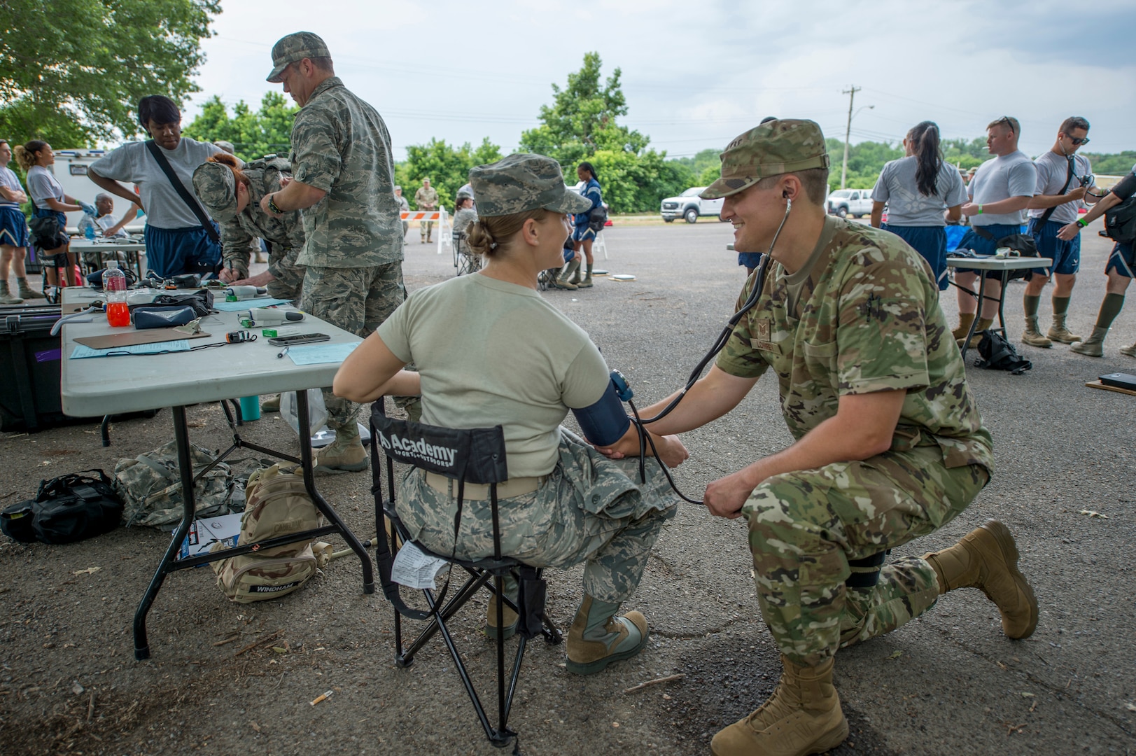 Members of the 116th Medical Group, Detachment 1, check participants’ vital signs during FEMA exercise Shaken Fury 2019 on June 5 in Millington, Tenn. Forty-four medical and communications personnel with the 116th Air Control Wing, Georgia Air National Guard, served on the CBRNE Enhanced Response Force working alongside more than 200 Georgia National Guard soldiers, testing the synergy necessary to support the community during natural disasters like the simulated earthquake in the exercise. (U.S. Air National Guard photo by Tech. Sgt. Nancy Goldberger/RELEASED)