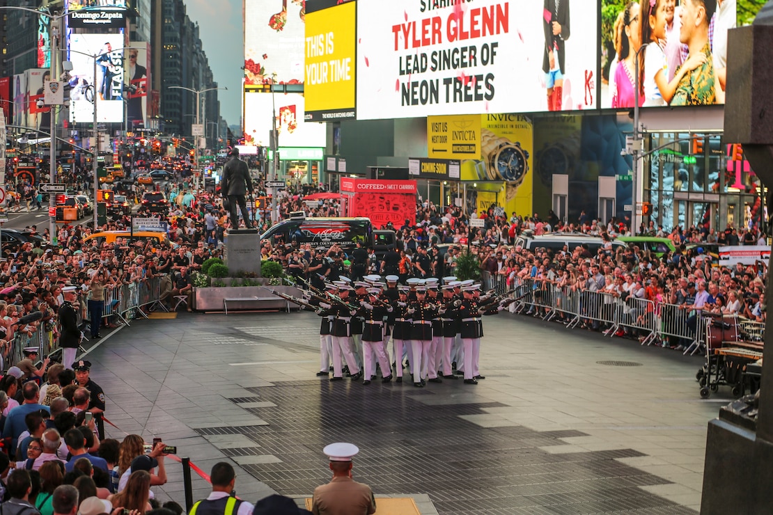 Marines with the U.S. Marine Corps Silent Drill Platoon execute their “bursting bomb” sequence during their performance as a part of a Battle Color Ceremony for New York Fleet Week at Times Square, Manhattan, NY, May 27, 2018. Fleet Week New York is an opportunity for the American public to meet their Marine Corps, Navy and Coast Guard teams and experience America’s sea services.