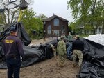 Members of the New York Naval Militia deploy a water filled barrier on the Lake Ontario shoreline to protect property from rising lake waters on May, 29, 2019. State military units, including National Guard Soldiers and Airmen, have joined forces to help allay flooding.