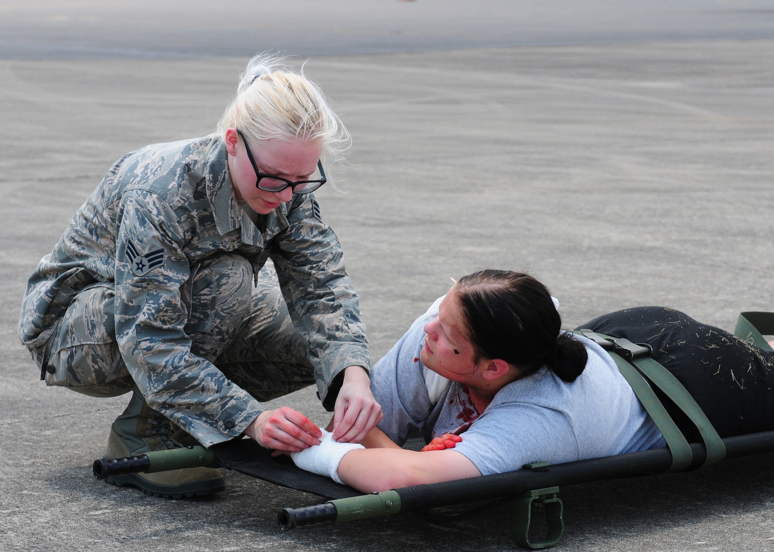 U.S. Air Force Senior Airman Megan Dolash, a medical technician with the 118th medical group, Tennessee Air National Guard tends to a cadet from Volunteer Challenge Academy at a mass casualty event during the Shaken Fury exercise at Smyrna Airport, Smyrna, Tennessee, June 1, 2019. Shaken Fury is a Federal Emergency Management Agency led exercise simulating a catastrophic earthquake along the New Madrid Seizmic Zone (NMSZ) near Memphis, Tennessee. The purpose of the exercise is to examine and improve the community's response to a "no-notice" earthquake, recognize shortfalls in resources, and develop a coordinated recovery plan. (U.S. Air National Guard photo by Master Sgt. Jeremy Cornelius/RELEASED)