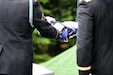Soldiers from the 101st Airborne Division fold the flag during a graveside service for Staff Sgt. Al Mampre. Mampre served as a medic with Easy Company, 2nd Battalion, 506th Parachute Infantry Regiment, 101st Airborne Division during World War II.