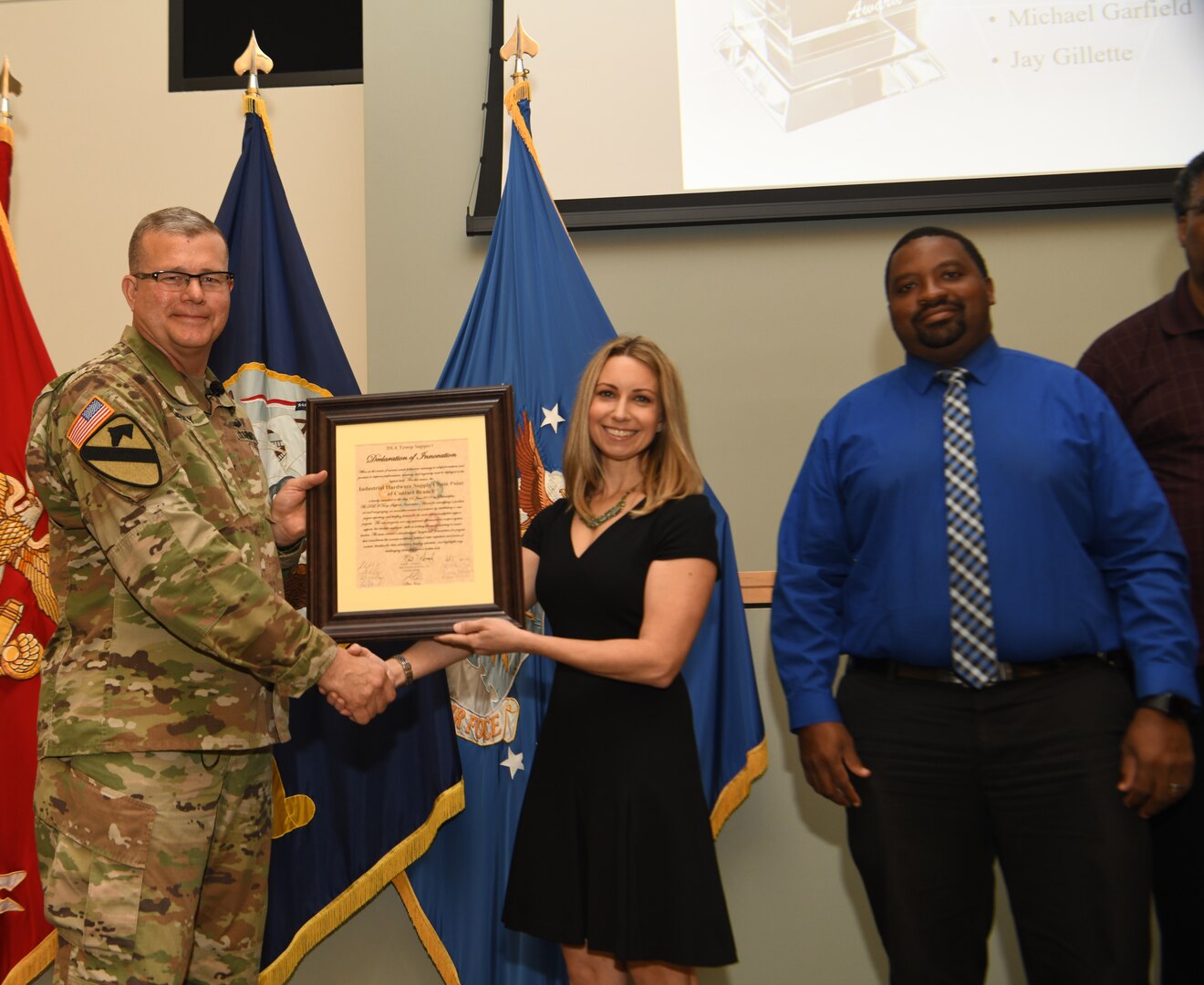 Defense Logistics Agency Troop Support commander Army Brig. Gen. Mark Simerly presents the DLA Troop Support Declaration of Innovation to the Industrial Hardware supply chain’s Supply Chain Point of Contact team during a town hall in Philadelphia, June 11, 2019. The Supply Chain Point of Contact team was recognized for streamlining project data to effectively engage all of the supply chain’s internal functional areas to collaborate on corrective actions by creating a standardized storyboard presentation for projects. (Photo by Ed Maldonado /DLA Troop Support)