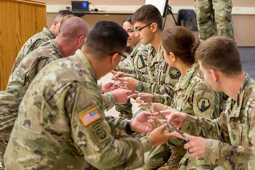 Soldiers from various units take part in a teambuilding event during the first day of Diamond Saber at Fort McCoy, Wisc., June 18, 2019. Diamond Saber, the Army’s only major financial management exercise, is designed to provide realistic technical training to regular Army, Army Reserve and Army National Guard FM units through interactive scenarios and transactions based upon current policy in a collective environment. (U.S. Army photo by Russell Gamache)