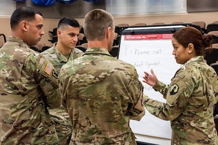 Soldiers from various units have a discussion during the first day of Diamond Saber at Fort McCoy, Wisc., June 18, 2019. Diamond Saber, the Army’s only major financial management exercise, is designed to provide realistic technical training to regular Army, Army Reserve and Army National Guard FM units through interactive scenarios and transactions based upon current policy in a collective environment. (U.S. Army photo by Russell Gamache)