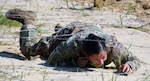 Army 1st Lt. Samantha Frank low crawls during the Brooke Army Medical Center Best Medic Competition at Joint Base San Antonio-Camp Bullis June 12. BAMC Soldiers competed for the title of Best Medic during the grueling competition with included an obstacle course.