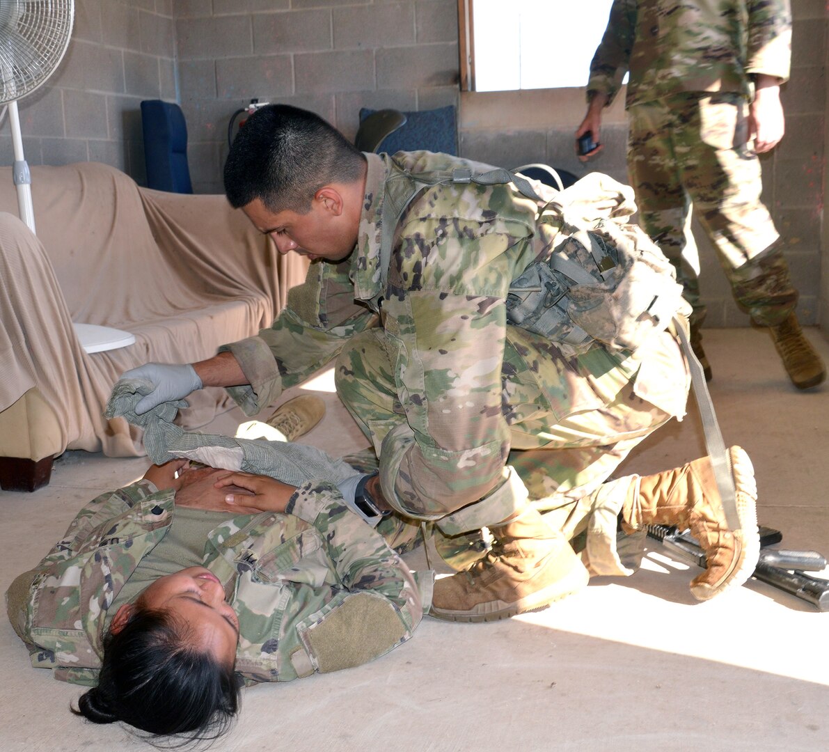 Army Sgt. Kevin Ramirez assesses a casualty during the tactical combat casualty care portion of the Brooke Army Medical Center Best Medic Competition at Joint Base San Antonio-Camp Bullis June 12. The competitors were tested on both warrior and medic skills during the competition.