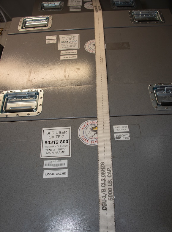 California Urban Search and Rescue Task Force 7 equipment containers are loaded inside the bay of a C-17 Globemaster III aircraft during a joint inspection and logistics drill conducted with 60th Aerial Port Squadron personnel June 13, 2019 at Travis Air Force Base, California. The annual training helps members of CA TF-7 learn about the process, governing and directives and ensures cargo is safe before loading onto an aircraft. (U.S. Air Force photo by Heide Couch)