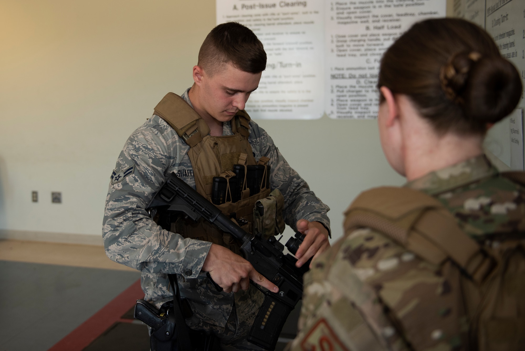 U.S. Air Force Airman 1st Class Christopher Shaffer, 60th Security Forces Squadron installation patrolman, clears his M4 rifle June 18, 2019, at Travis Air Force Base, California. Security Forces Airmen like Shaffer are responsible for protecting resources and personnel for the Air Force’s largest air mobility wing. (U.S. Air Force photo by Tech. Sgt. James Hodgman)