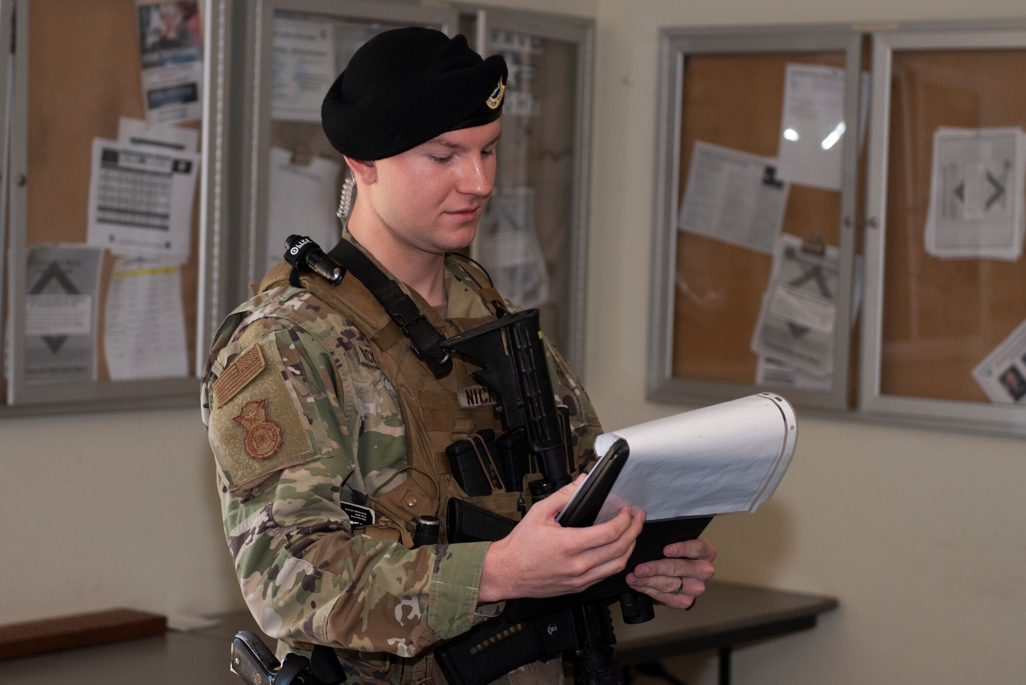 U.S. Air Force Staff Sgt. Dallas Nickerson, 60th Security Forces Squadron installation patrolman, briefs members of the 60th SFS at afternoon guardmount June 18, 2019, at Travis Air Force Base, California. Guardmount is a mandatory formation for all security forces Airmen prior to posting out for their shift. Security Forces Airmen like Nickerson are responsible for protecting resources and personnel for the Air Force’s largest air mobility wing. (U.S. Air Force photo by Tech. Sgt. James Hodgman)