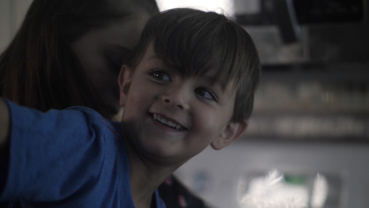 Levi Kinkton, son of Aviation Machinists Mate 2nd Class Dakota “Kody” Kinkton smiles during a family photo.