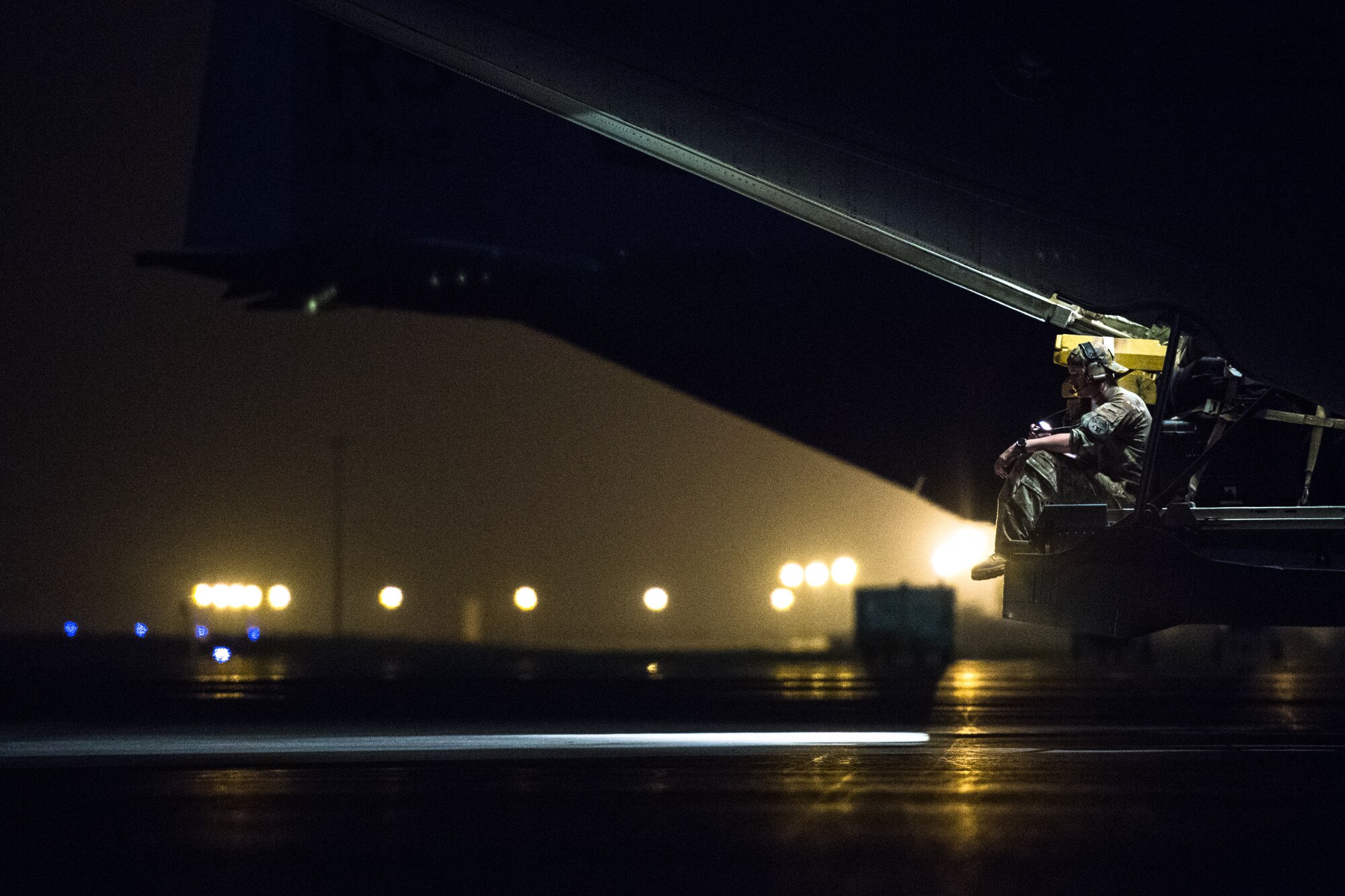U.S. Air Force Staff Sgt. Dillon Lafond, 75th Expeditionary Airlift Squadron loadmaster, sits on the back of a C-130J Super Hercules before flying out of Camp Lemonnier, Djibouti, June 5, 2019. The 75th EAS provides support in medical evacuations, disaster relief, humanitarian and airdrop operations. (U.S. Air Force photo by Staff Sgt. Devin Boyer)