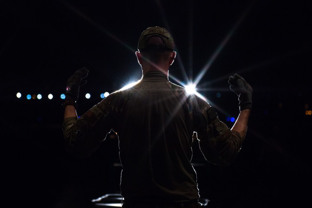 U.S. Air Force Staff Sgt. Dillon Lafond, 75th Expeditionary Airlift Squadron loadmaster, directs a forklift to the ramp of a C-130J Super Hercules at Camp Lemonnier, Djibouti, June 5, 2019. The 75th EAS provides support in medical evacuations, disaster relief, humanitarian and airdrop operations. (U.S. Air Force photo by Staff Sgt. Devin Boyer)