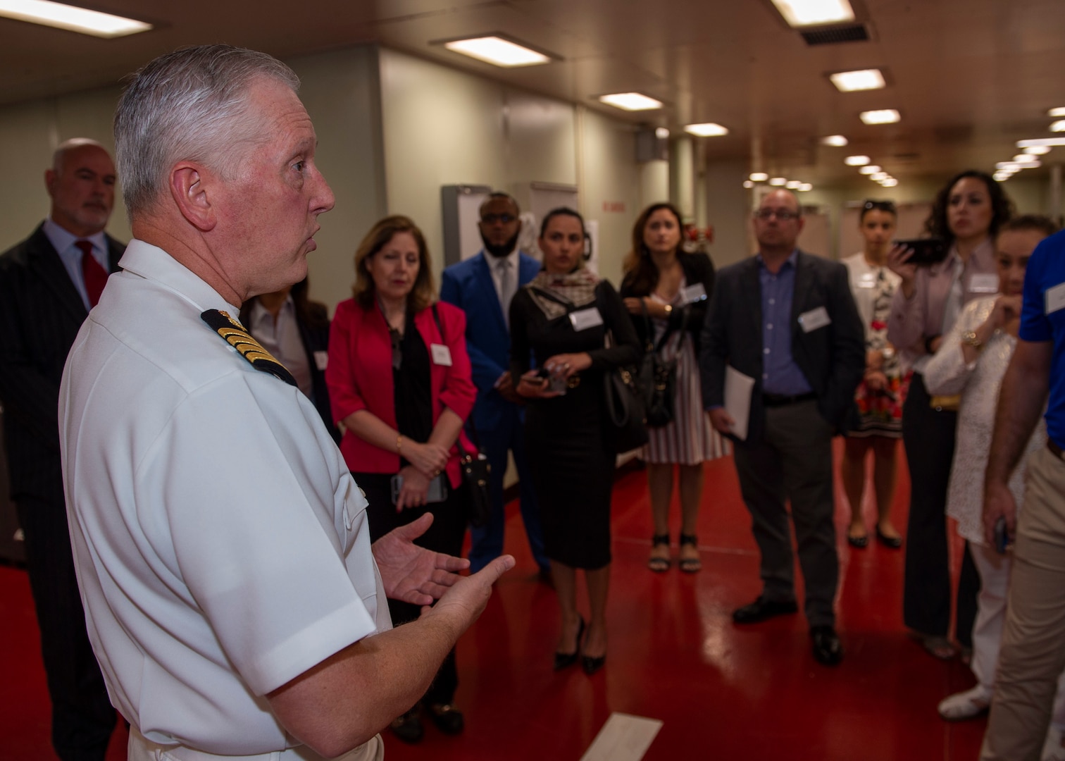 Capt. Kevin P. Buss, director of nursing services, guides a tour of the hospital ship USNS Comfort (T-AH 20). C
