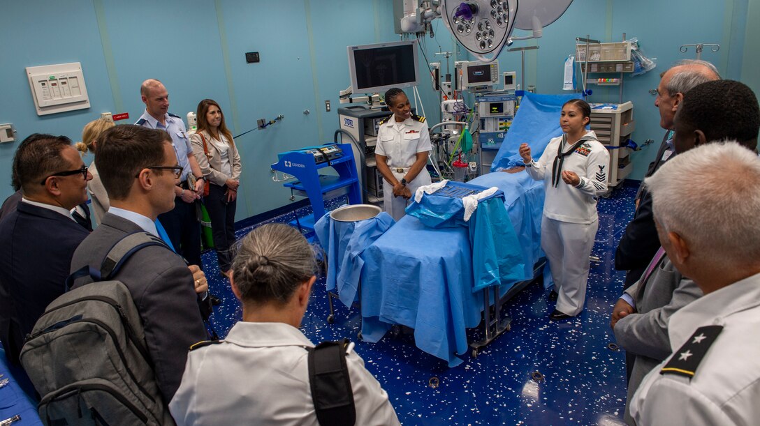 Hospital Corpsman 1st Class Edna Wallace from El Paso, Texas, and Lt. Gwendolyn Mann, from Hampton, Va., guide a tour of the hospital ship USNS Comfort (T-AH 20).
