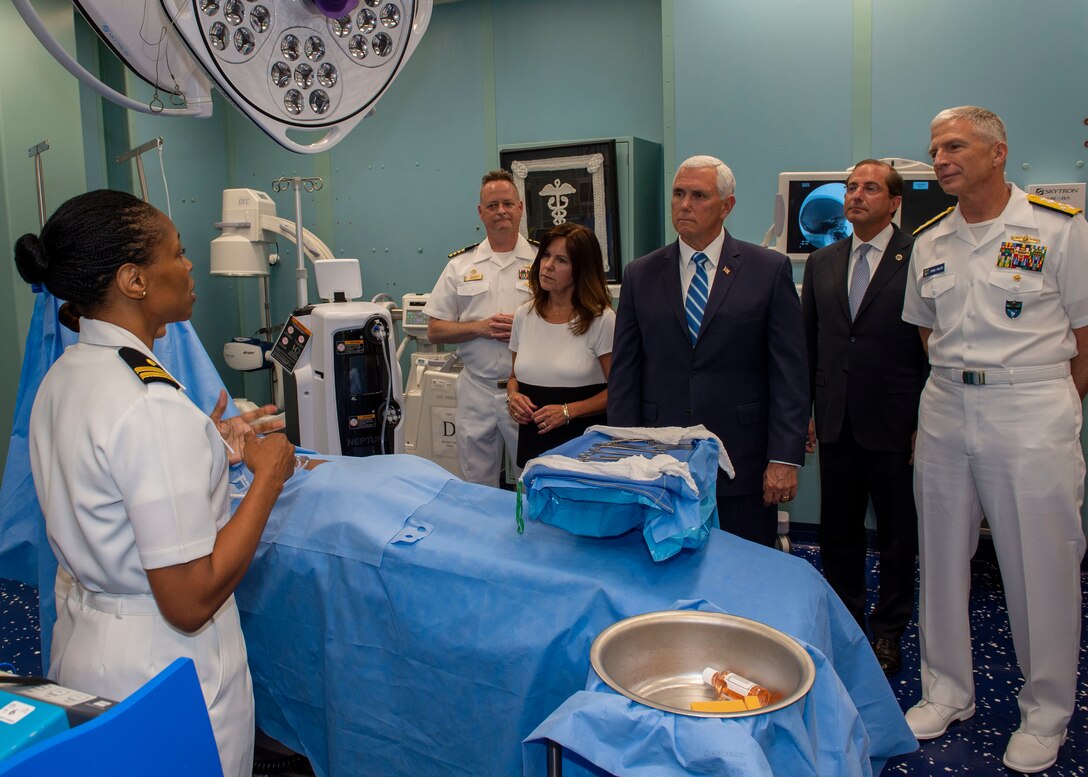 Lt. Gwendolyn Mann, from Hampton, Va., shows Vice President Mike Pence and second lady Karen Pence an operating room during a tour of the hospital ship USNS Comfort (T-AH 20).