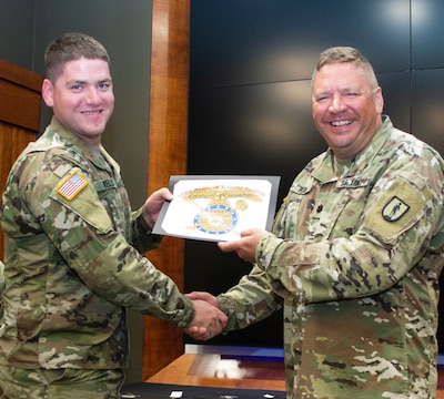 Sgt. Patrick Wells of West Union, Illinois graduates from the Culinary Specialist Reclassification Course.