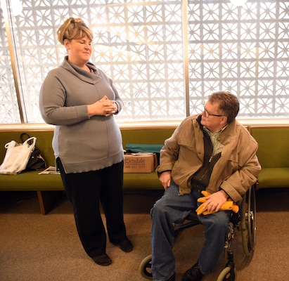 Shelley Statler chats with former Hot Springs County Sheriff John Lumley prior to a memorial service for Technician 5 Joseph Mulvaney, who received long-overdue honors March 29, 2019 in Cody, Wyoming.