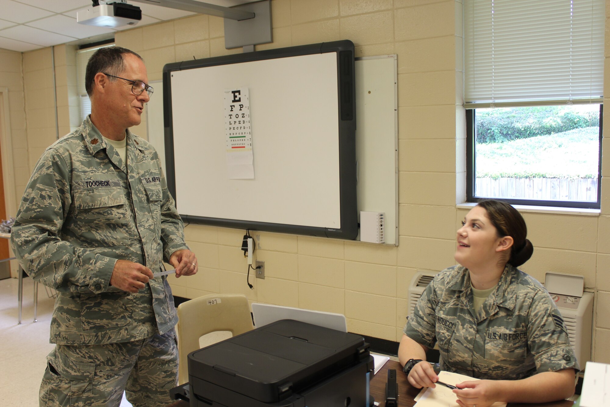 Maj. Daniel Toocheck, optometrist with the 514th Aerospace Medicine Squadron, 514th Air Mobility Wing located in Joint Base McGuire-Dix-Lakehurst, N.J., shares a moment with Senior Airman Katelyn Buonanducci, medical technician with the 103rd Medical Group, 103rd Airlift Wing located in Bradley Air National Guard Base, Conn. Both are participating in the East Central Georgia Innovative Readiness Training 2019.