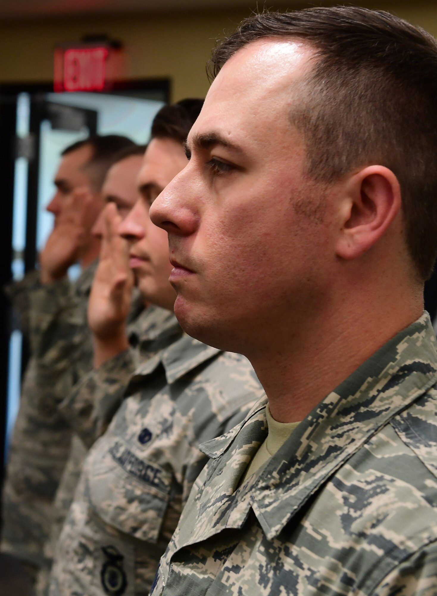 Members of the 911th Security Forces Squadron are administered the Noncommisioned Officer Charge during an NCO promotion and induction ceremony at the Pittsburgh International Airport Air Reserve Station, Pennsylvania, June 2, 2019. Three members were promoted to the rank of staff sergeant and one member was promoted to technical sergeant during the ceremony.