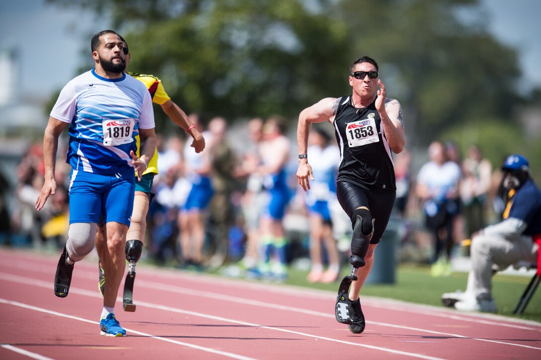 U.S. Marine Corps Staff Sgt. Jason Pacheco, right, competes in the men’s 200-meter race during the 2018 Marine Corps Trials track competition at Marine Corps Base Camp Lejeune, N.C., March 20, 2018. The Marine Corps Trials promotes recovery and rehabilitation through adaptive sport participation and develops camaraderie among recovering service members and veterans. It is an opportunity for RSMs to demonstrate their achievements and serves as the primary venue to select Marine Corps participants for the DoD Warrior Games.