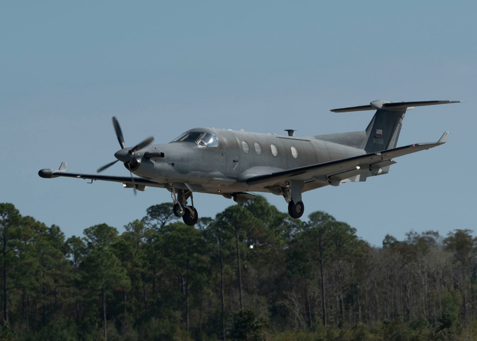 One aircraft flying, preparing to land.