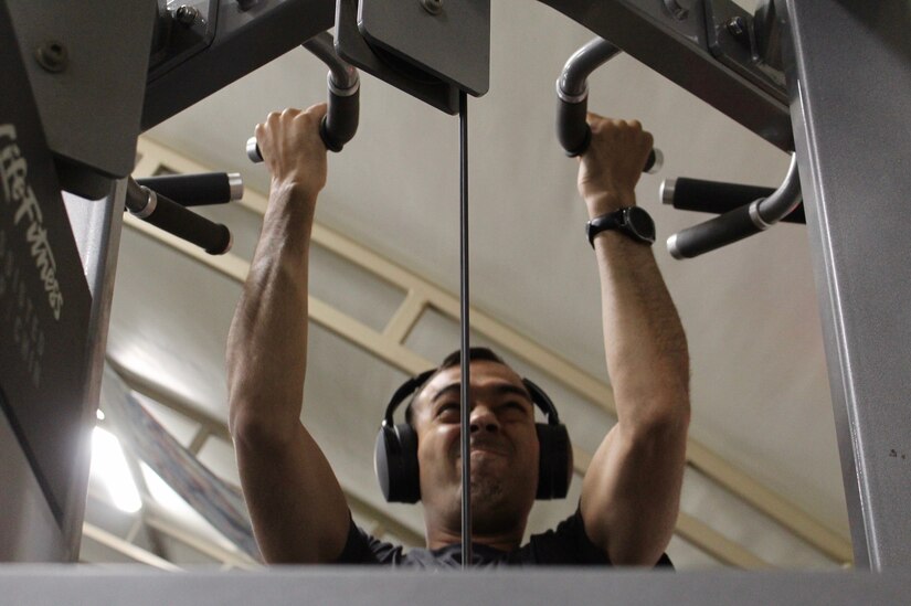 Staff Sgt. Govinda L. Acuna, 595th Transportation Brigade, works out at 3:30 a.m. at Camp Arifjan, Kuwait, June 4, 2019.