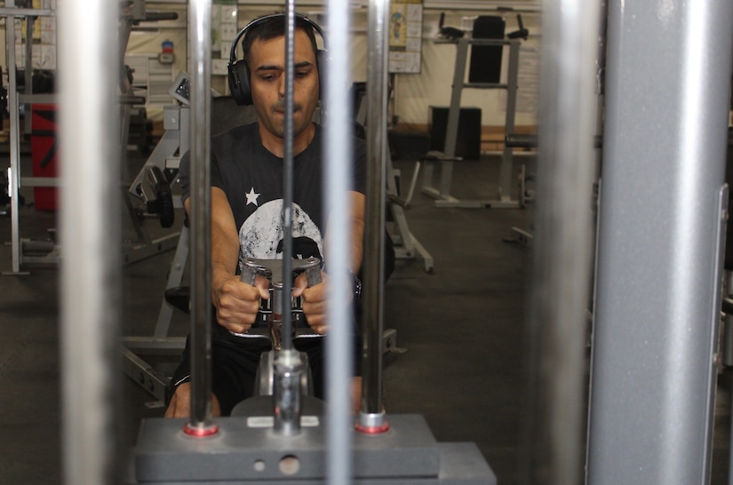 Staff Sgt. Govinda L. Acuna, 595th Transportation Brigade, works out at 3:30 a.m. before heading to work at Camp Arifjan, Kuwait, June 4, 2019.