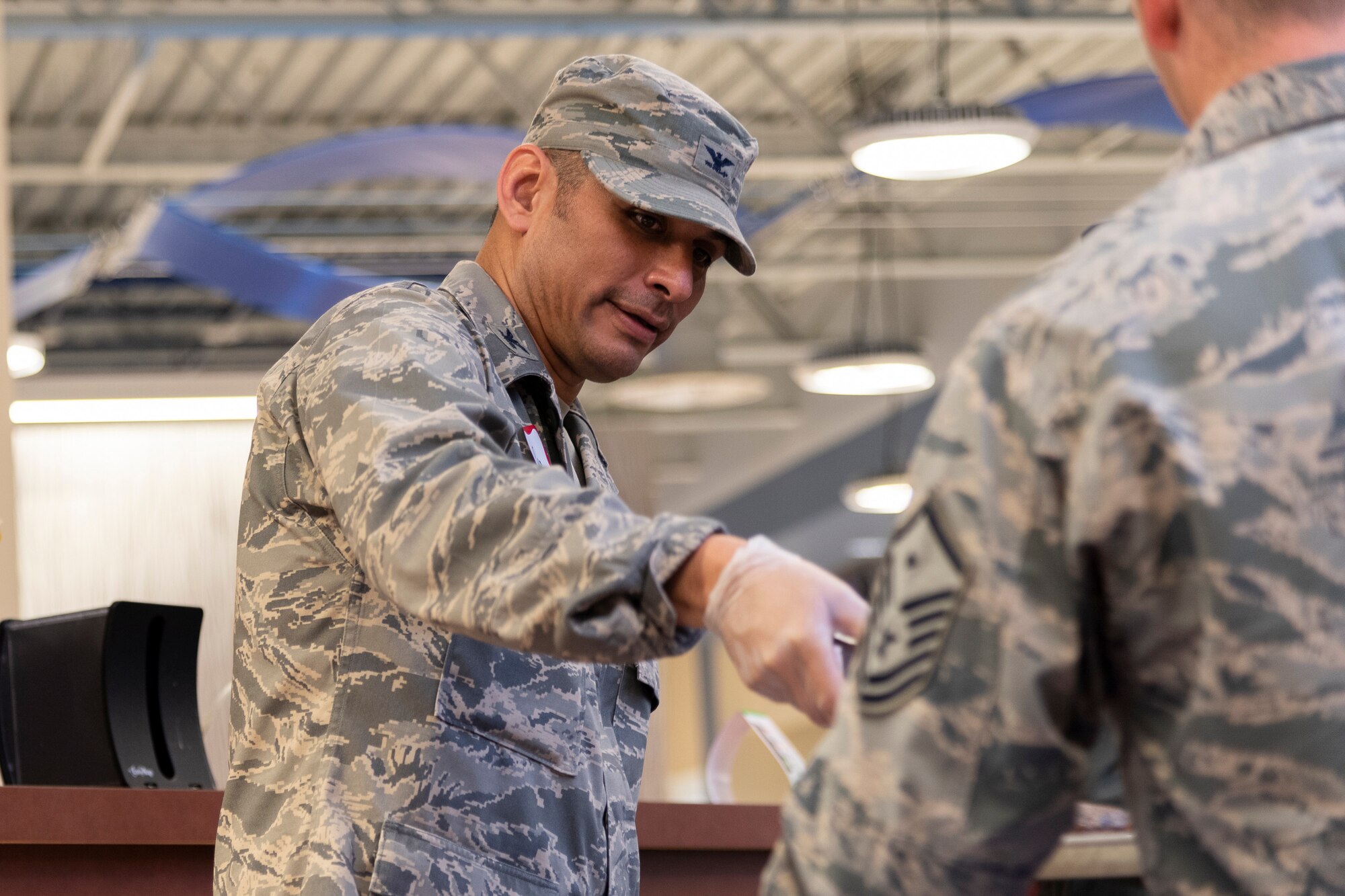 Col. Benjamin Conde, 23d Wing vice commander, serves food during a deployed spouse dinner, June 18, 2019, at Moody Air Force Base, Ga. The dinner served as an opportunity for the families of deployed members to bond and provide relief. The mission's success depends on resilient Airmen and families, who are prepared to make sacrifices with the support of their fellow Airmen, local communities and leadership. (U.S. Air Force photo by Airman 1st Class Hayden Legg)