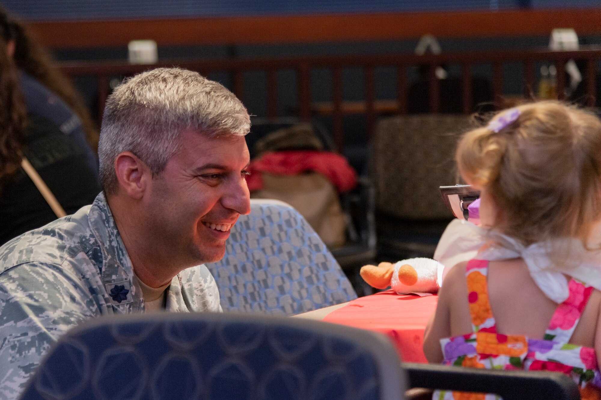 Lt. Col. Thane Sisson, 23d Maintenance Squadron commander, talks with a participant of a deployed spouse dinner, June 18, 2019, at Moody Air Force Base, Ga. The dinner served as an opportunity for the families of deployed members to bond and provide relief. The mission's success depends on resilient Airmen and families, who are prepared to make sacrifices with the support of their fellow Airmen, local communities and leadership. (U.S. Air Force photo by Airman 1st Class Hayden Legg)