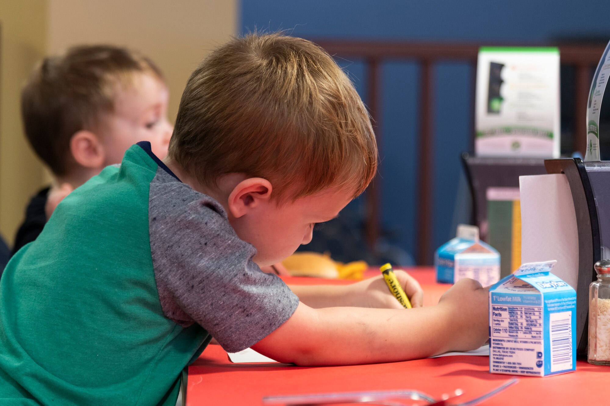 Participants color during a deployed spouse dinner, June 18, 2019, at Moody Air Force Base, Ga. The dinner served as an opportunity for the families of deployed members to bond and provide relief. The mission's success depends on resilient Airmen and families, who are prepared to make sacrifices with the support of their fellow Airmen, local communities and leadership. (U.S. Air Force photo by Airman 1st Class Hayden Legg)