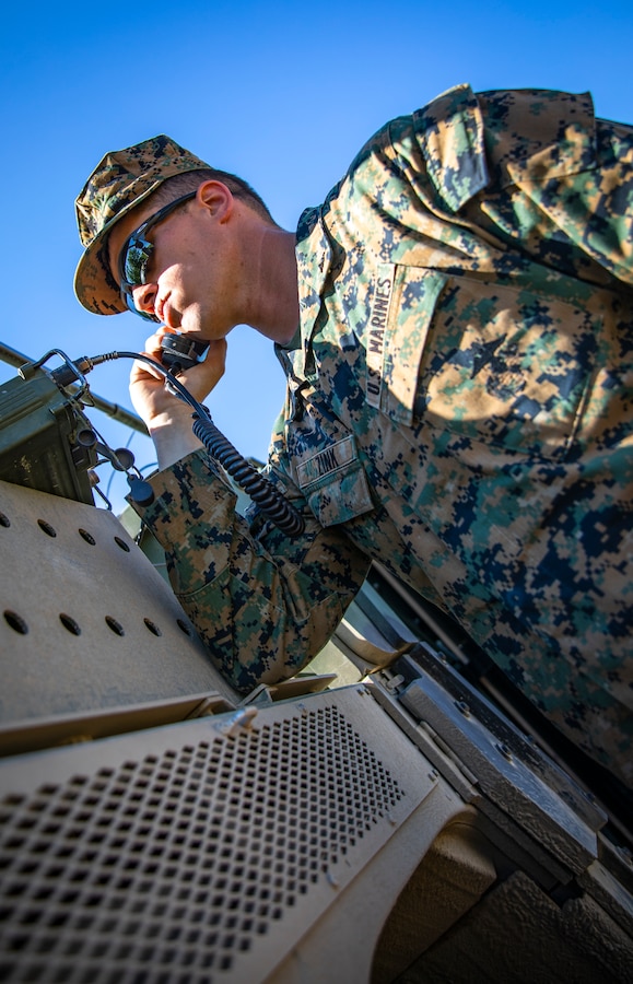 U.S. Marine Corps Lance Cpl. Evan Zink, a radio operator with Marine Wing Support Squadron 471, Marine Aircraft Group 41, 4th Marine Aircraft Wing, speaks on a radio system during a Forward Arming Refueling Point operation at Cold Lake Air Weapons Range, Alberta, Canada, June 18, 2019, in support of Sentinel Edge 19. Exercises like SE19 ensure MARFORRES is a proficient force, ready for world-wide deployment at any given time. (U.S. Marine Corps photo by Sgt. Andy O. Martinez)