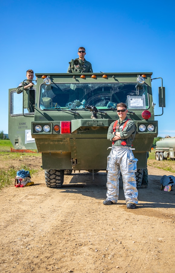 U.S. Marine aircraft rescue and firefighting specialists with Marine Wing Support Squadron 471, Marine Aircraft Group 41, 4th Marine Aircraft Wing, pose for a photo during a Forward Arming Refueling Point operation at Cold Lake Air Weapons Range, Alberta, Canada, June 18, 2019, in support of Sentinel Edge 19. Exercises like SE19 ensure MARFORRES is a proficient force, ready for world-wide deployment at any given time. (U.S. Marine Corps photo by Sgt. Andy O. Martinez)