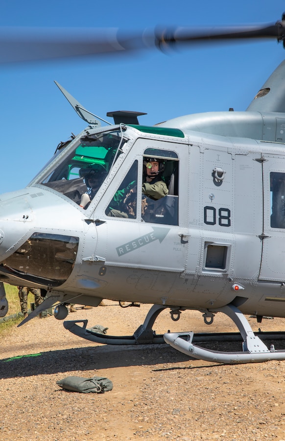 A UH-1Y Venom pilot with Marine Light Attack Helicopter Squadron 775, Marine Aircraft Group 41, 4th Marine Aircraft Wing, waits for his aircraft to be refueled during Forward Arming Refueling Point operations at Cold Lake Air Weapons Range, Alberta, Canada, June 18, 2019, in support of Sentinel Edge 19. Exercises like SE19 ensure MARFORRES is a proficient force, ready for world-wide deployment at any given time. (U.S. Marine Corps photo by Sgt. Andy O. Martinez)