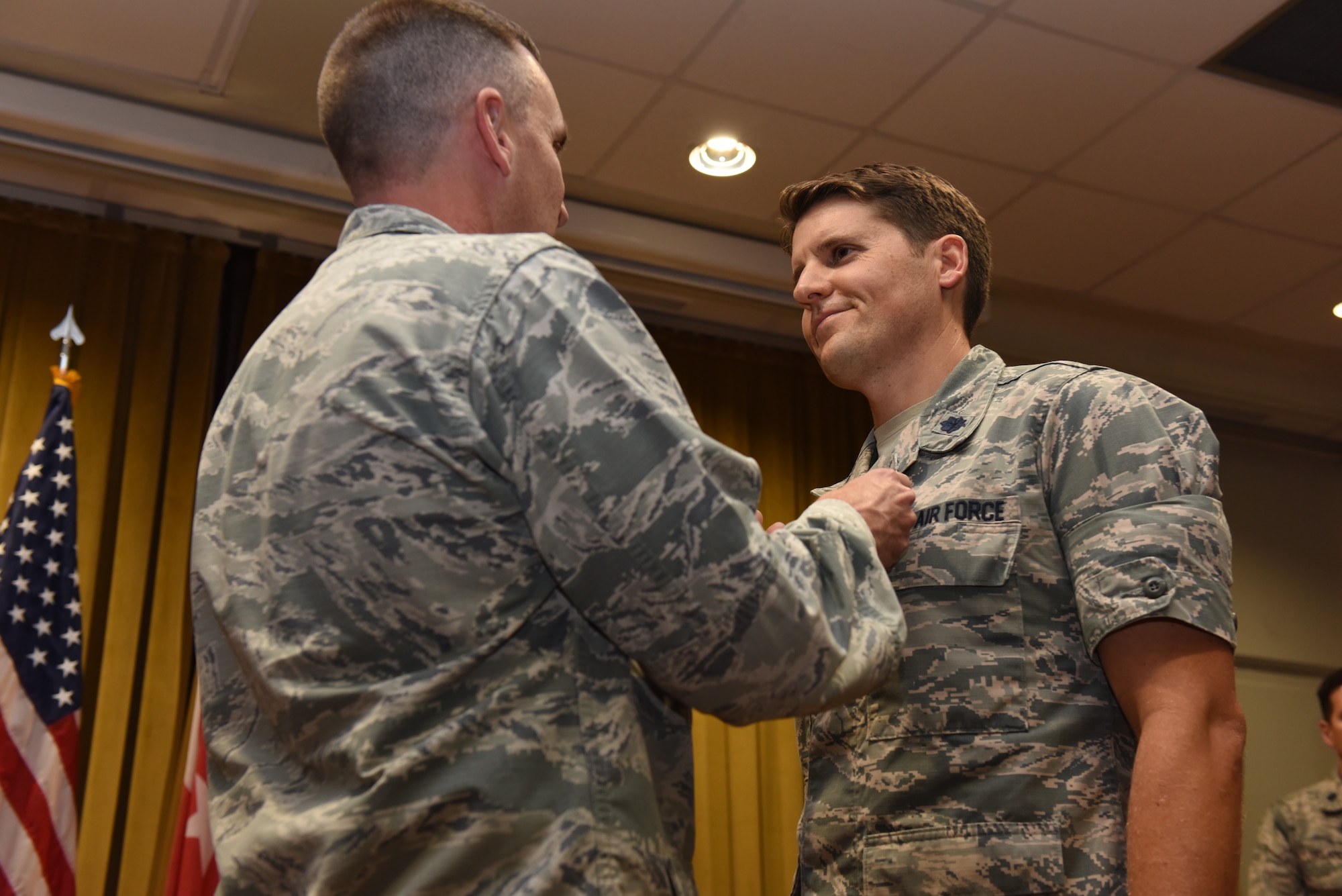 Photo go medical group commander awards the Meritorious Service Medal to the out going medical support squadron commander.