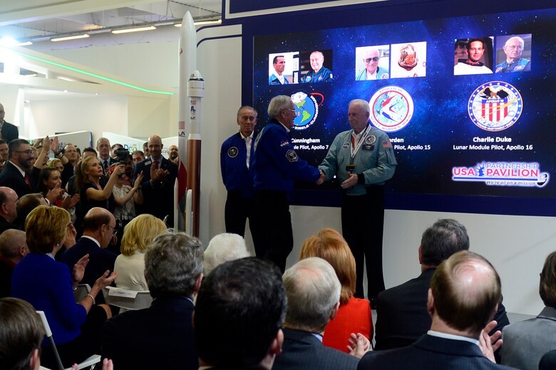 Former National Aeronautics and Space Administration astronauts Retired U.S. Marine Corps Col. Walt Cunningham, left, Retired U.S. Air Force Brig. Gen. Charlie Duke, center, and Retired U.S. Air Force Col. Al Worden, right, are applauded during an opening ceremony at the Paris Air Show, June 17, 2019.