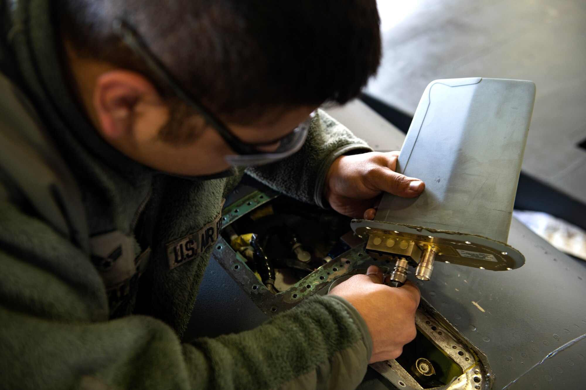 A 48th Maintenance Group Airman works on an F-15E Strike Eagle during a phase inspection at Royal Air Force Lakenheath, England, June 20, 2019. 48th Fighter Wing Airmen regularly inspect F-15s for discrepancies, big and small, ensuring the aircraft can perform as good as new. (U.S. Air Force photo by Senior Airman Malcolm Mayfield)