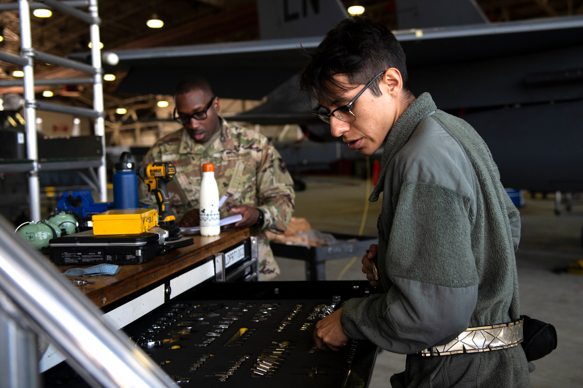 A 48th Maintenance Group Airman searches through a toolbox during a phase inspection of an F-15E Strike Eagle at Royal Air Force Lakenheath, England, June 20, 2019. After every 400 flying hours, F-15s undergo a nine-day-long inspection conducted by Airmen from several squadrons within the 48th MXG. (U.S. Air Force photo by Senior Airman Malcolm Mayfield)