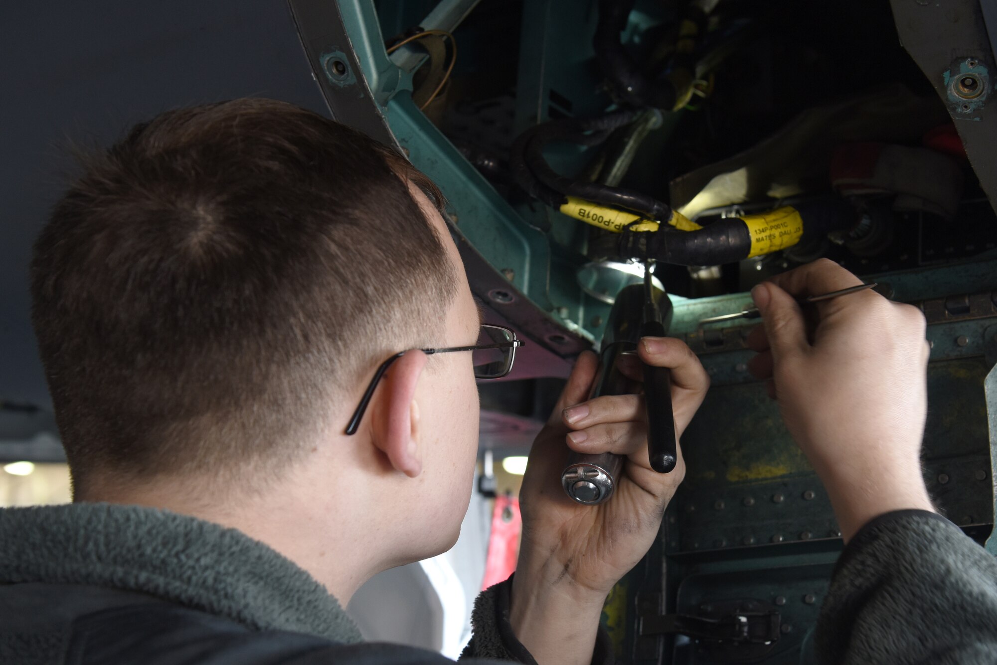 A 48th Maintenance Group Airman examines the inner workings of an F-15E Strike Eagle for discrepancies during a phase inspection at Royal Air Force Lakenheath, England, June 20, 2019. After every 400 flying hours, F-15s undergo a nine-day-long inspection conducted by Airmen from several squadrons within the 48th MXG. (U.S. Air Force photo by Airman 1st Class Ronda Smith)