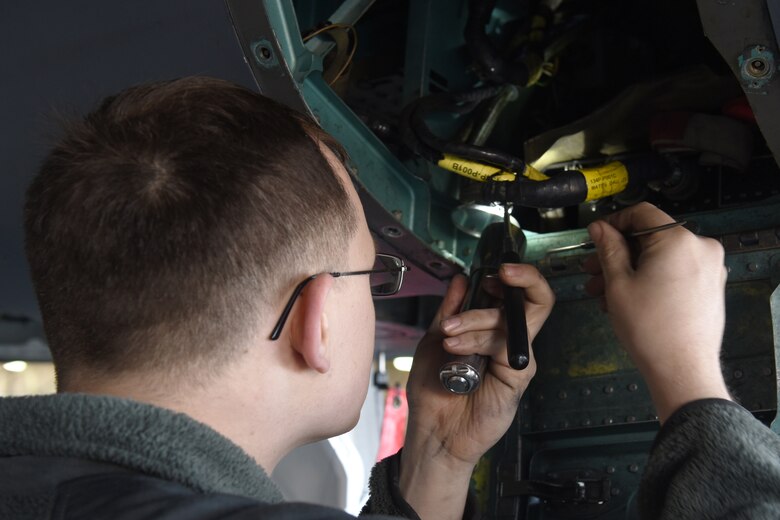 A 48th Maintenance Group Airman examines the inner workings of an F-15E Strike Eagle for discrepancies during a phase inspection at Royal Air Force Lakenheath, England, June 20, 2019. After every 400 flying hours, F-15s undergo a nine-day-long inspection conducted by Airmen from several squadrons within the 48th MXG. (U.S. Air Force photo by Airman 1st Class Ronda Smith)