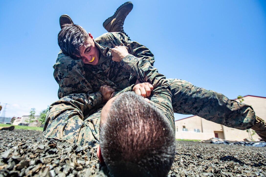 U.S. Marine Corps Lance Cpl. Jacob Wren, air traffic controller with Headquarters and Headquarters Squadron, Marine Corps Air Station Camp Pendleton, attempts to perform the “counter to the mount” technique during Marine Corps Martial Arts Program training at the MCAS Camp Pendleton MCMAP pit, June 19, 2019. Around the base, Marines conduct MCMAP training to strengthen their abilities in hand-to-hand combat and build their warrior ethos.
