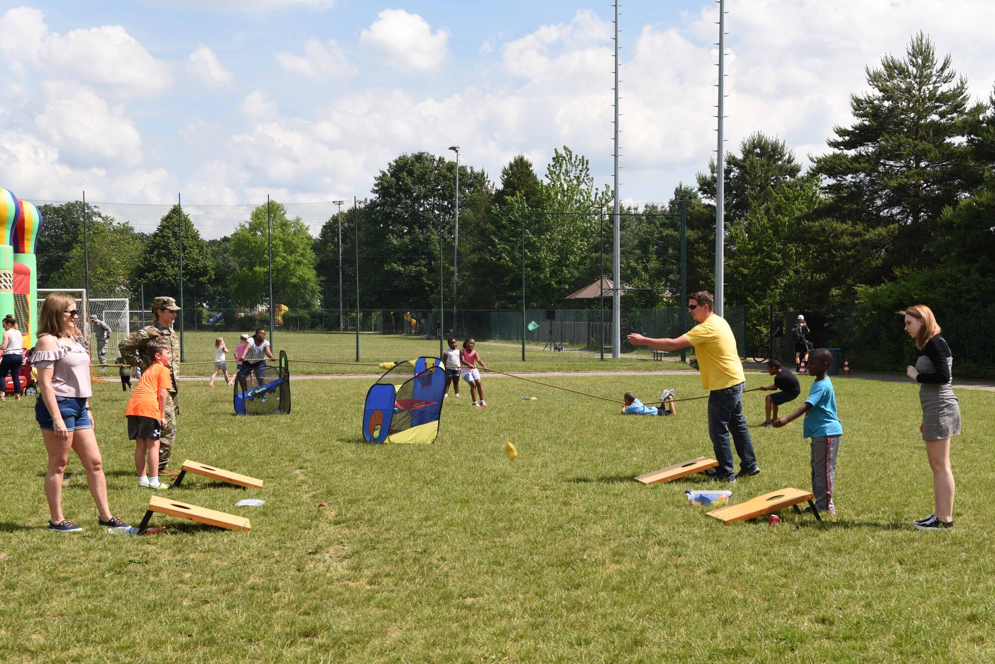 Team Ramstein Airmen and civilians play cornhole during the Commander in Chief’s Installation Excellence Award barbecue at Donnelly Park on Ramstein Air Base, Germany, June, 18, 2019. The CINC Installation Excellence Award barbecue shined a light on the accomplishments of all Ramstein Airmen that resulted in Ramstein winning at the Department of Defense level award.