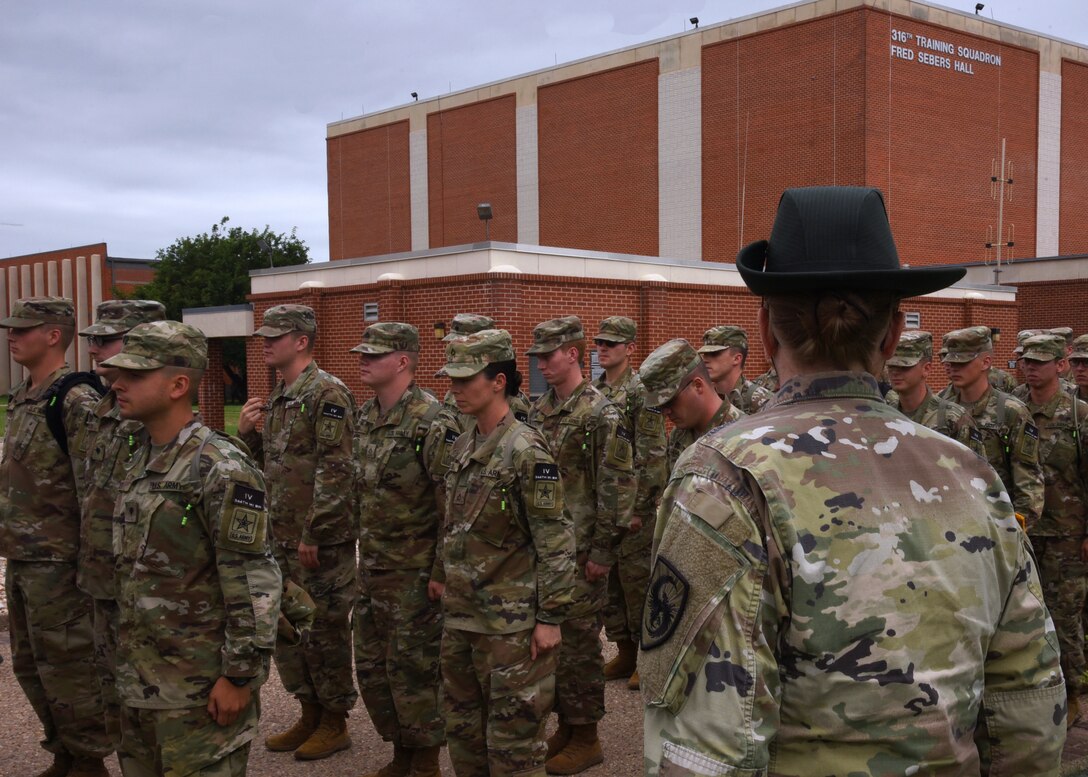 U.S. Army Staff Sgt. Sarah Artman, 344th Military Intelligence Battalion Company A drill sergeant, sizes her student platoon outside of the Fred Sebers Hall on Goodfellow Air Force Base, Texas, June 18, 2019. Goodfellow falls under the Air Education and Training Command and offers exceptional training for all branches of the military and America’s Allies. (U.S. Air Force photo by Airman 1st Class Abbey Rieves/Released)