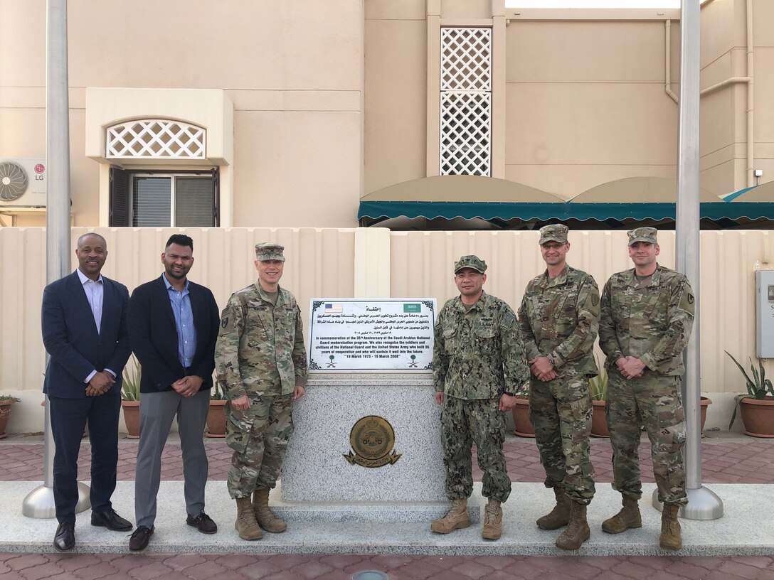 Peter Skillings, DLA Troop Support Medical’s Collective and Foreign Military Sales branch chief, left, and Abin Mathai, DLA Troop Support Medical’s Dressing, Tools and Instruments integrated support team chief, second to left, pose for a photo in Riyadh, Saudi Arabia May 2019.